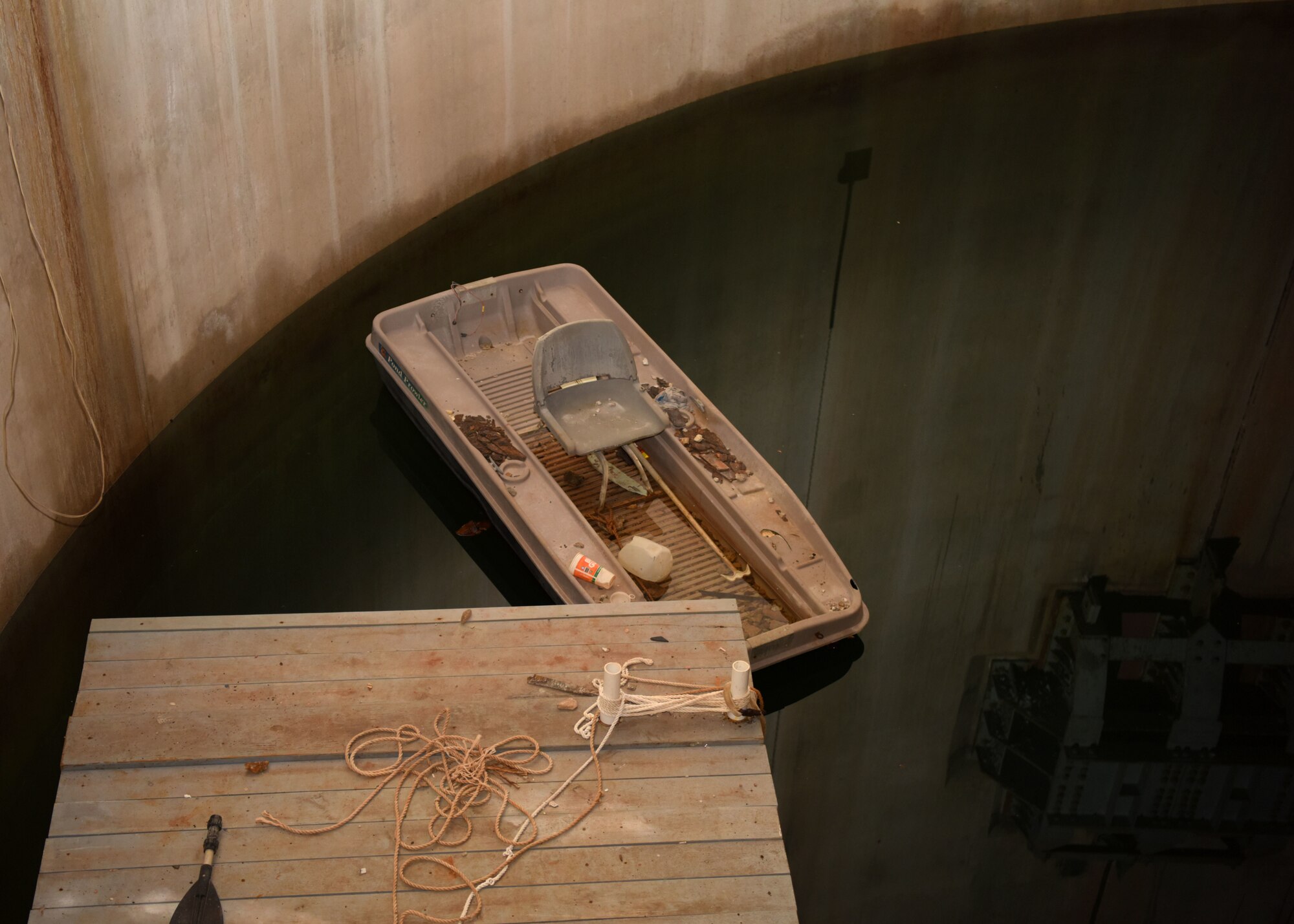 Owner of the Lawn Atlas Missile Base, Larry Sanders’ boat sits in the flooded missile silo at the LAMB in Lawn, Texas, Oct. 26, 2020. Sanders scuba dives into the silo with an experienced team to explore the silo and restore it. (U.S. Air Force photo by Airman 1st Class Ethan Sherwood)