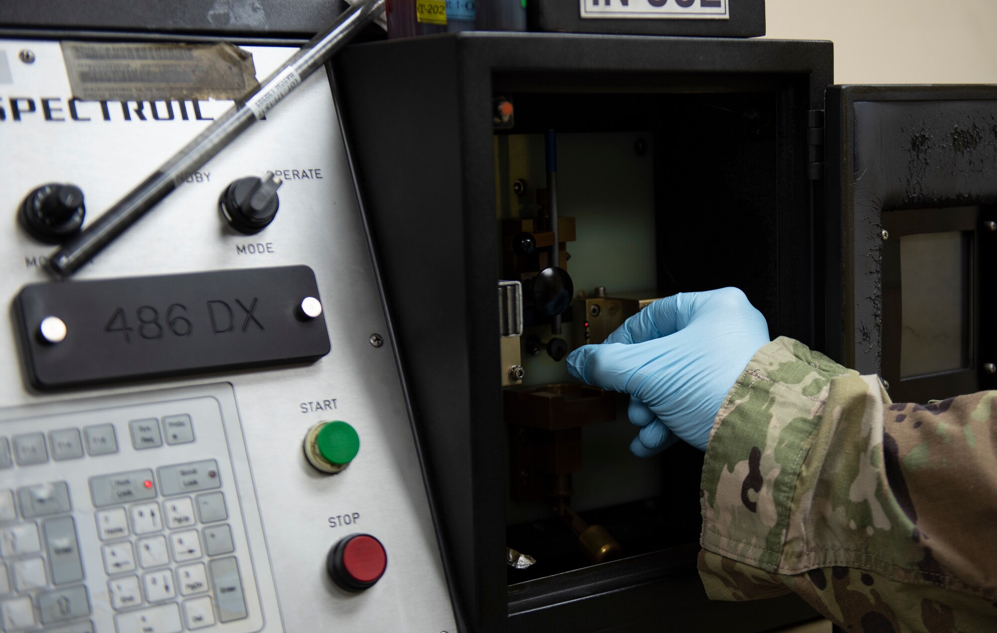 Tech. Sgt. Patrick Oliver, noncommissioned officer in charge of non-destructive inspections assigned to the 36th Maintenance Squadron puts in a sample to the Spectroil M oil analysis machine Oct. 22, 2020, at Andersen Air Force Base, Guam.