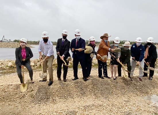 Federal and state partners shovel ceremonial sand to kick-off the official start of the Jacksonville District's Central Everglades Planning Project South at a groundbreaking ceremony.in Miami today. (USACE photo by Mark Rankin)