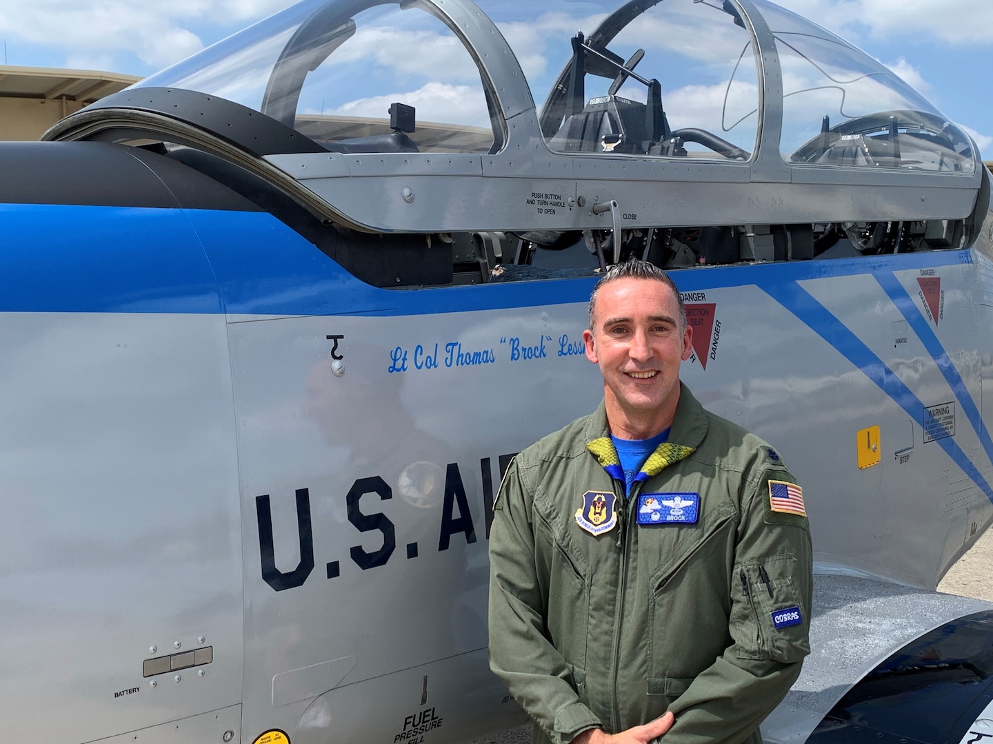 Lt. Col. Thomas Lessner, 39th Flying Training Squadron commander and Air Force Reserve Command T-1 instructor pilot, stands beside the squadron's T-6 flagship aircraft, which the host wing - 12th Flying Training Wing-Joint Base San Antonio-Randolph, Texas - painted in the heritage scheme used on the P-51 “Little Girl” flown by Capt. Leroy Grosshuesch, commander of the then-designated 39th Fighter Squadron, during the during WWII single-handed attack on a Japanese destroyer off Goto Retto near Kyushu, Japan in 1945. (U.S. Air Force photo)