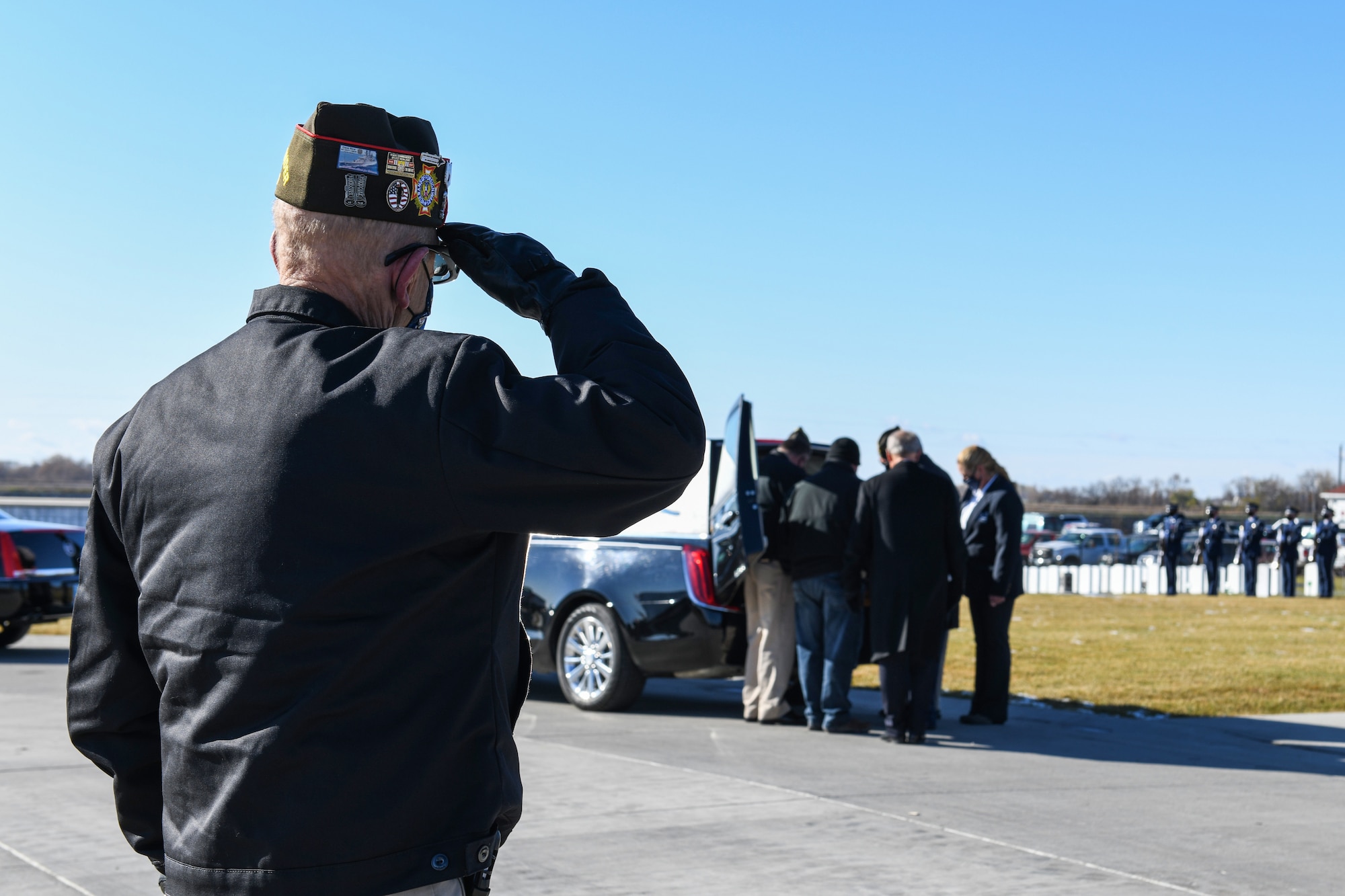 A veteran from the Fargo Veterans of Foreign Wars renders a salute to a fallen brother in arms Oct. 16, 2020, at the Fargo National Cemetary, N.D. Veterans from across the sate and many other supporters showed up to honor an unclaimed veteran. (U.S. Air Force photo by Ashley Richards)