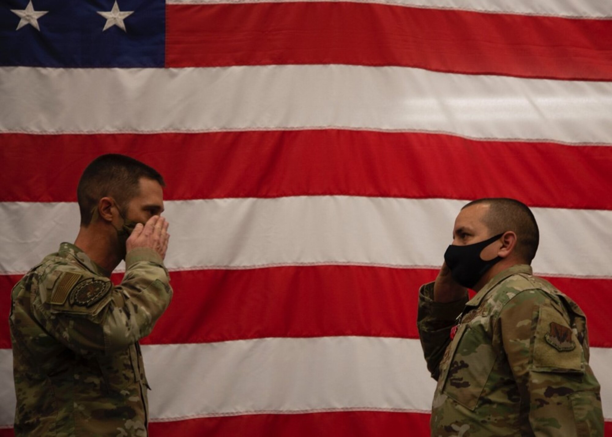 U.S. Air Force Lt. Col. Kevin Fletcher, 726th Air Control Squadron commander, salutes Master Sgt. Joe Rodriguez, 726th Air Control Squadron RF transmissions systems NCOIC, at Mountain Home Air Force Base, Idaho, on Oct. 9, 2020. Rodriquez served as the RF transmissions systems NCOIC at Asad Airbase, Iraq, from Oct. 9, 2019 to June 23, 2020. (U.S. Air Force Photo by Airman 1st Class Eric Brown)