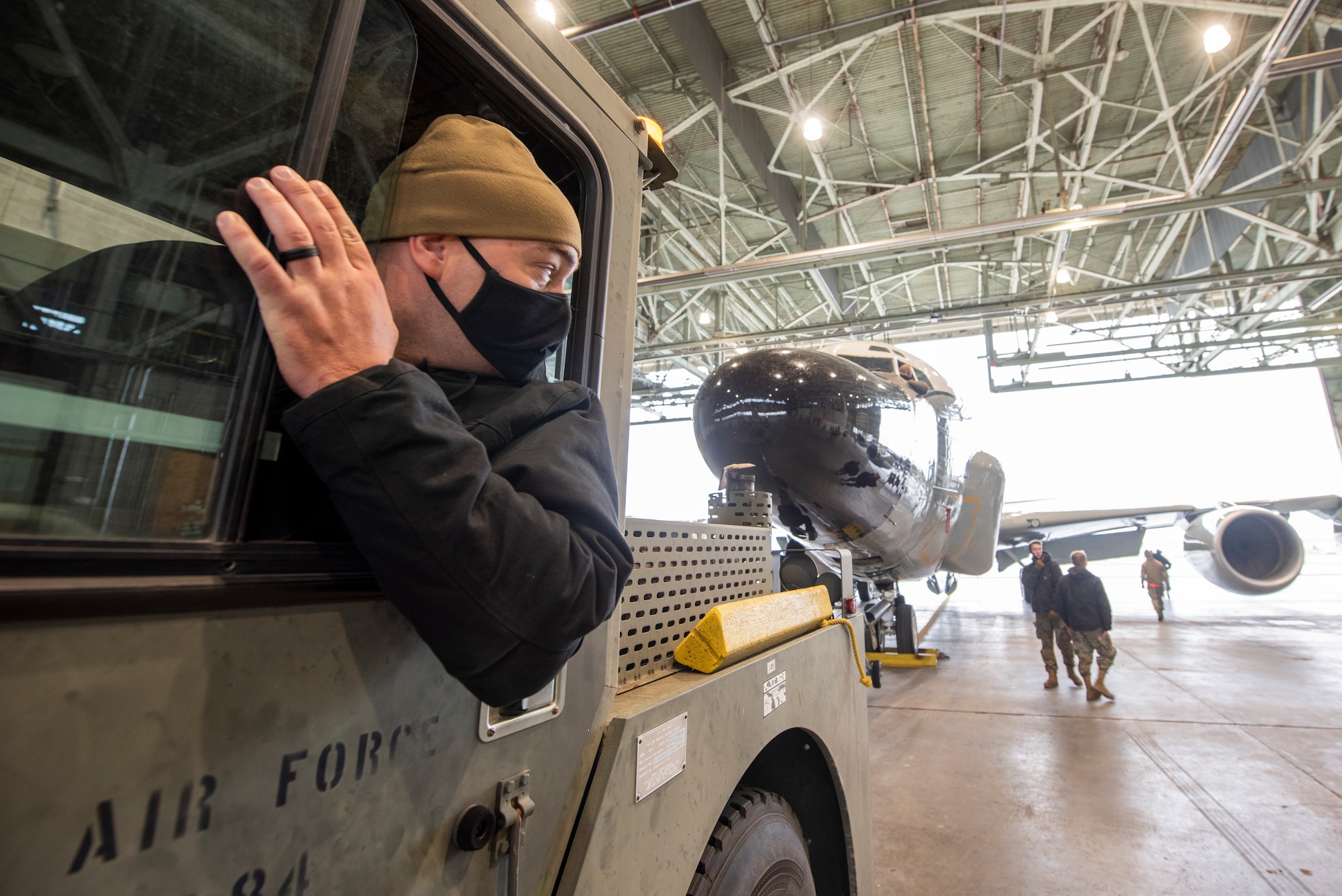 An Airman tows an aircraft into the North Hangar at Lincoln Airport during a proof of concept exercise Oct. 23, 2020.