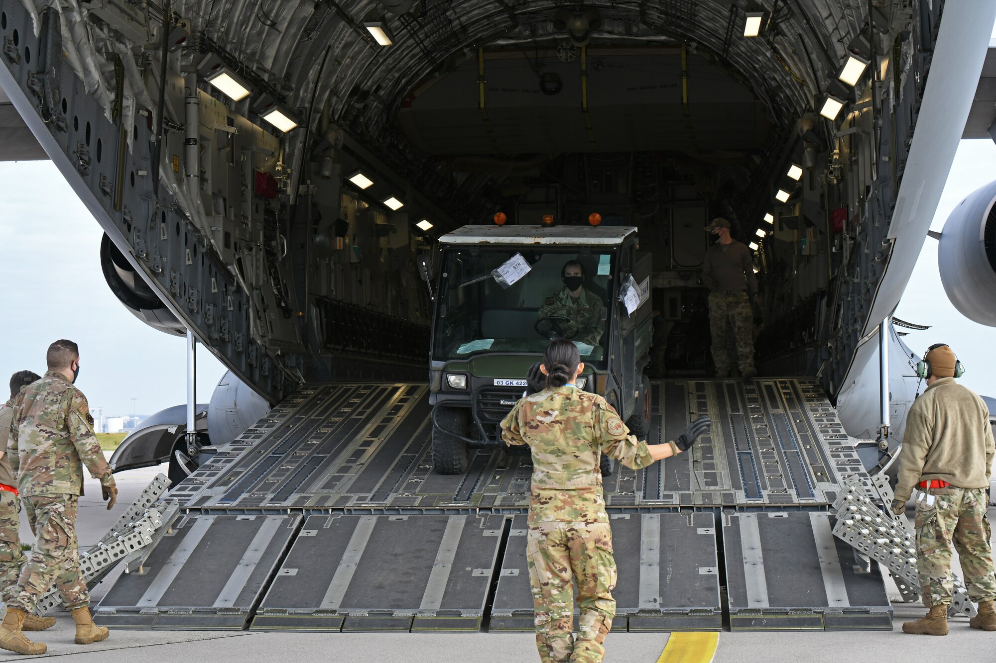 U.S. Air Force Airmen assigned to the 721st Air Mobility Operations Group, Ramstein Air Base, Germany, load a vehicle on to a U.S. Air Force C-17 Globemaster III aircraft during a multi-capable Airmen lift-and-shift training exercise, Nodal Lightning 20-2.