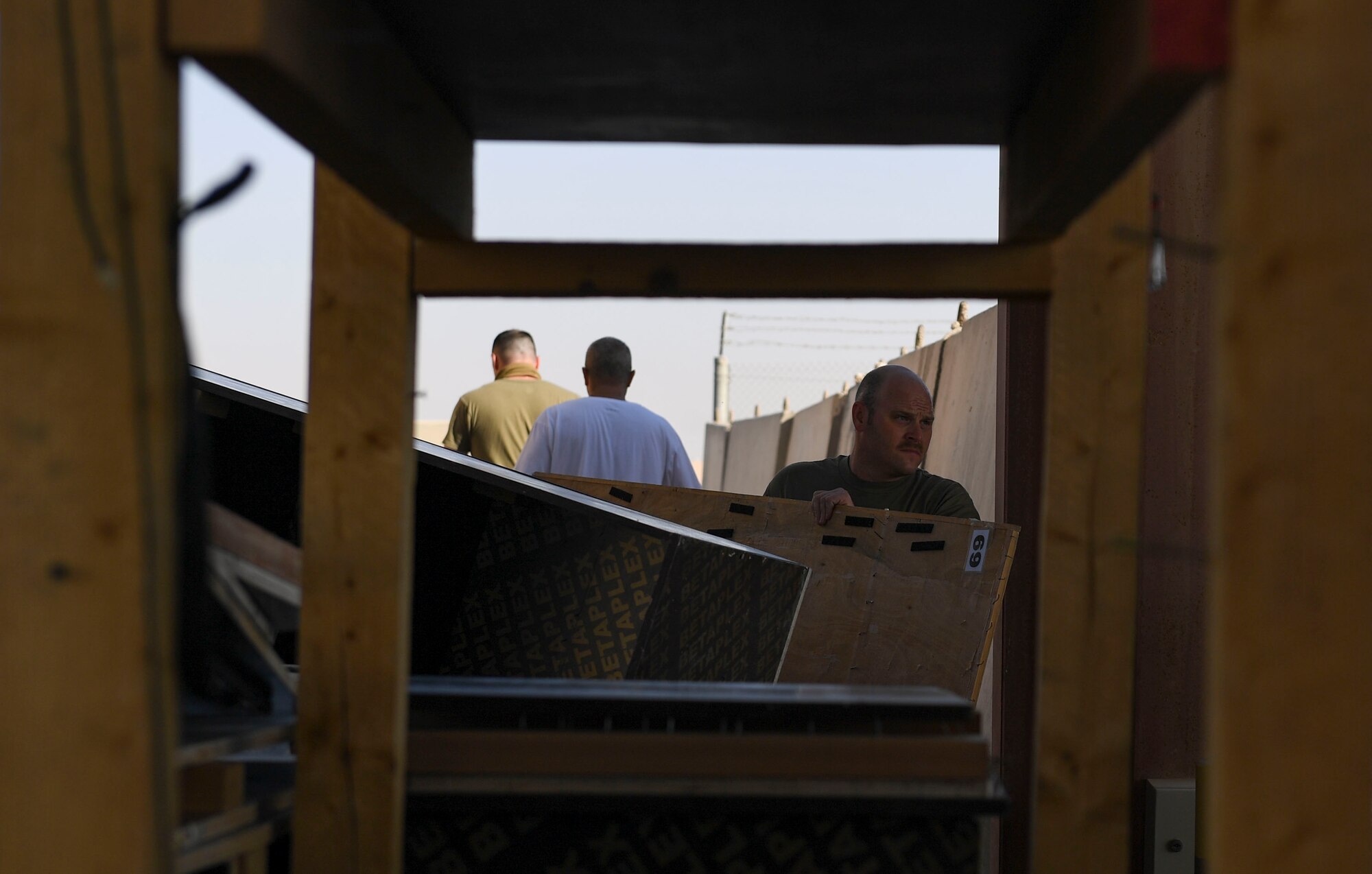 Demolition day volunteers move debris outside at Ali Al Salem Air Base, Kuwait, Oct. 21, 2020.