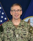Official portrait of Capt. Mark Bibeau, commanding officer, Naval Computer and Telecommunications Station (NCTS) Bahrain