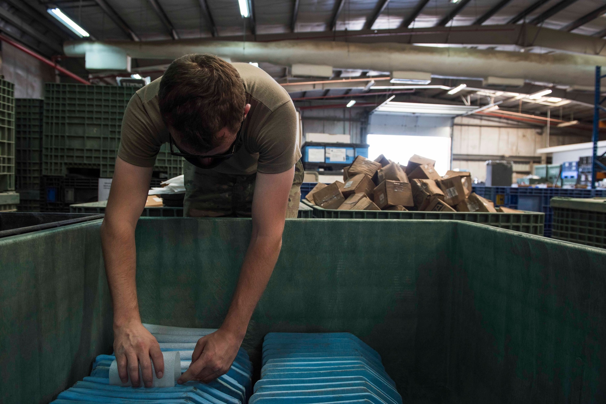 U.S. Air Force Airman 1st Class Bradan Phelps, 380th Expeditionary Logistics Readiness Squadron supply technician, packs ballistic plates at the individual protective equipment (IPE) warehouse on Al Dhafra Air Base, United Arab Emirates, Oct. 27, 2020.