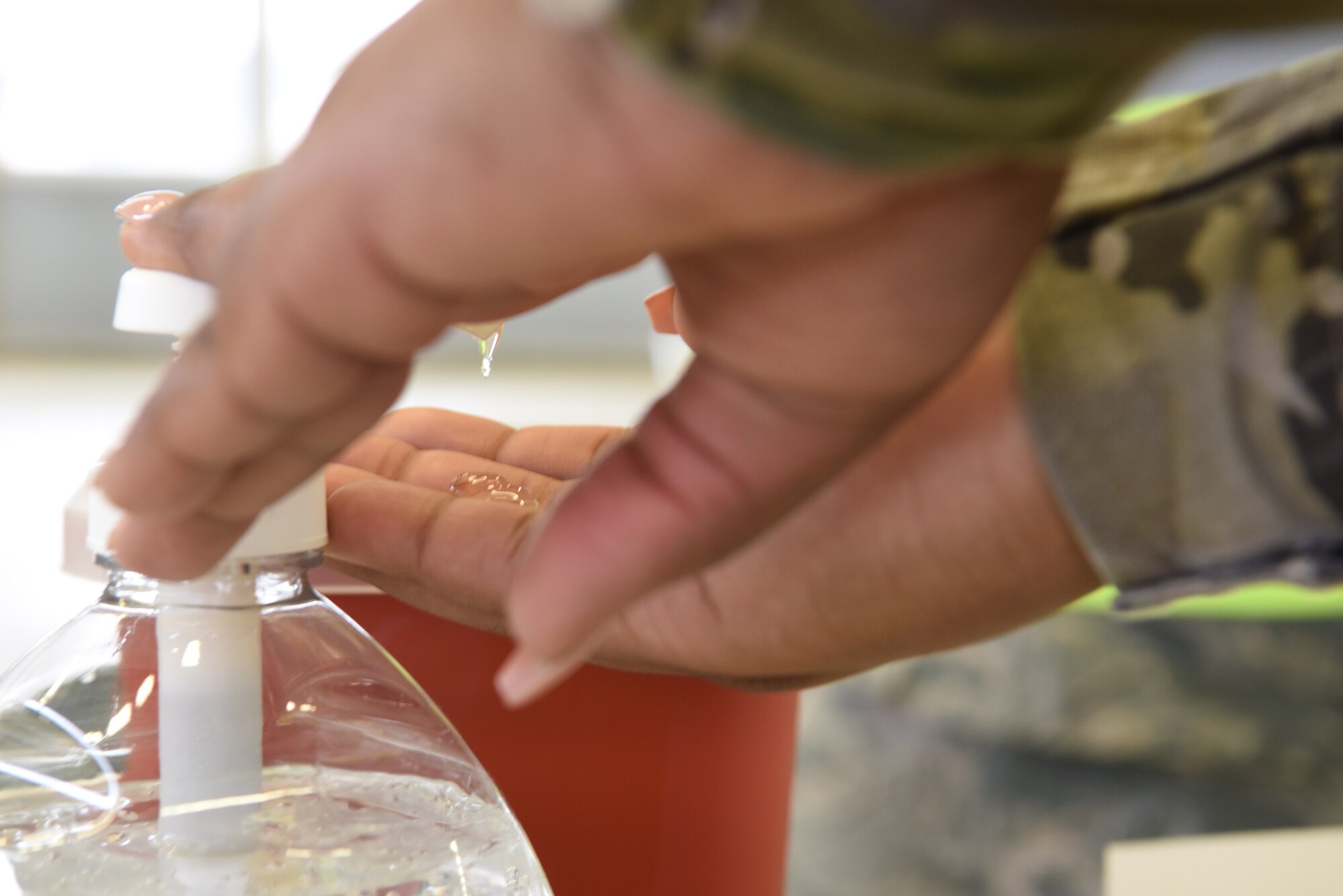 An Airman with the 86th Medical Group uses hand sanitizer prior to administering the flu vaccine to Airmen at Ramstein Air Base, Germany, Oct. 27, 2020.
