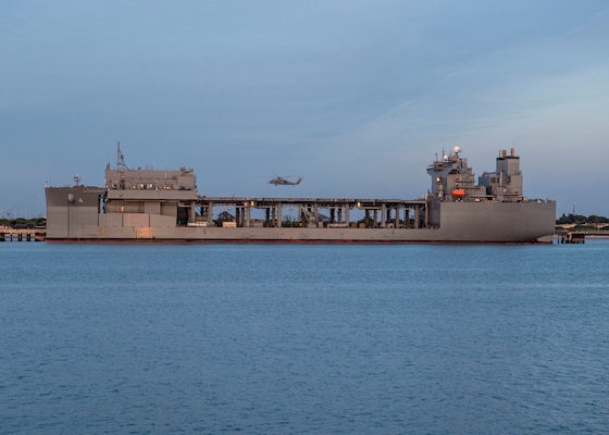 An MH-60S Sea Hawk helicopter attached to Helicopter Sea Combat Squadron (HSC) 28 takes off from the flight deck of the expeditionary sea base USS Hershel "Woody" Williams (ESB 4) at Naval Station Rota, Spain,