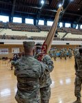 Maj. Gen. Richard Neely, the Adjutant General, Illinois National Guard, hands the guidon for the 108th Sustainment Brigade to its new commander, Lt. Col. Timothy Newman, at the change of command ceremony in Chicago, Illinois, Sep. 12.