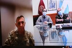 Argentine Army Col. Oscar Zarich (left), Argentine Partner Nation Liaison Officer, U.S. Army South, moderates a COVID-19 subject matter expert exchange between doctors from the Argentine Army and Brooke Army Medical Center Oct. 21.