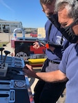 Firefighters Michael Budke and Craig Behrens, 155th Civil Engineering Squadron, run through a realistic fire scenario on a pump operations simulator Oct. 15, 2020, at Nebraska National Guard airbase in Lincoln, Nebraska. The squadron bought the simulator with the aid of U.S. Air Force innovation funds.