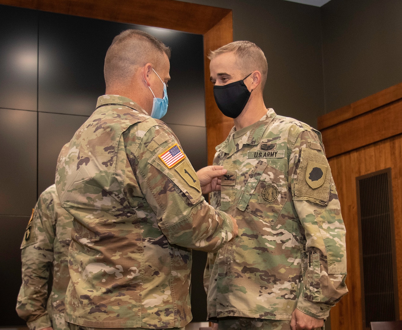 Newly promoted Col. Kevin G. Little’s brother, Brig. Gen. Eric Little, Vice Director, National Guard Bureau Force Structure, Resources and Assessment (J-8), places his new rank