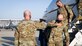 Maj. Gen. Christopher Azzano, Air Force Test Center commander, greets Gen. Arnold W. Bunch, Jr., commander of Air Force Materiel Command, as he arrives at Edwards Air Force Base, California, Oct. 23. (Air Force photo by Giancarlo Casem)