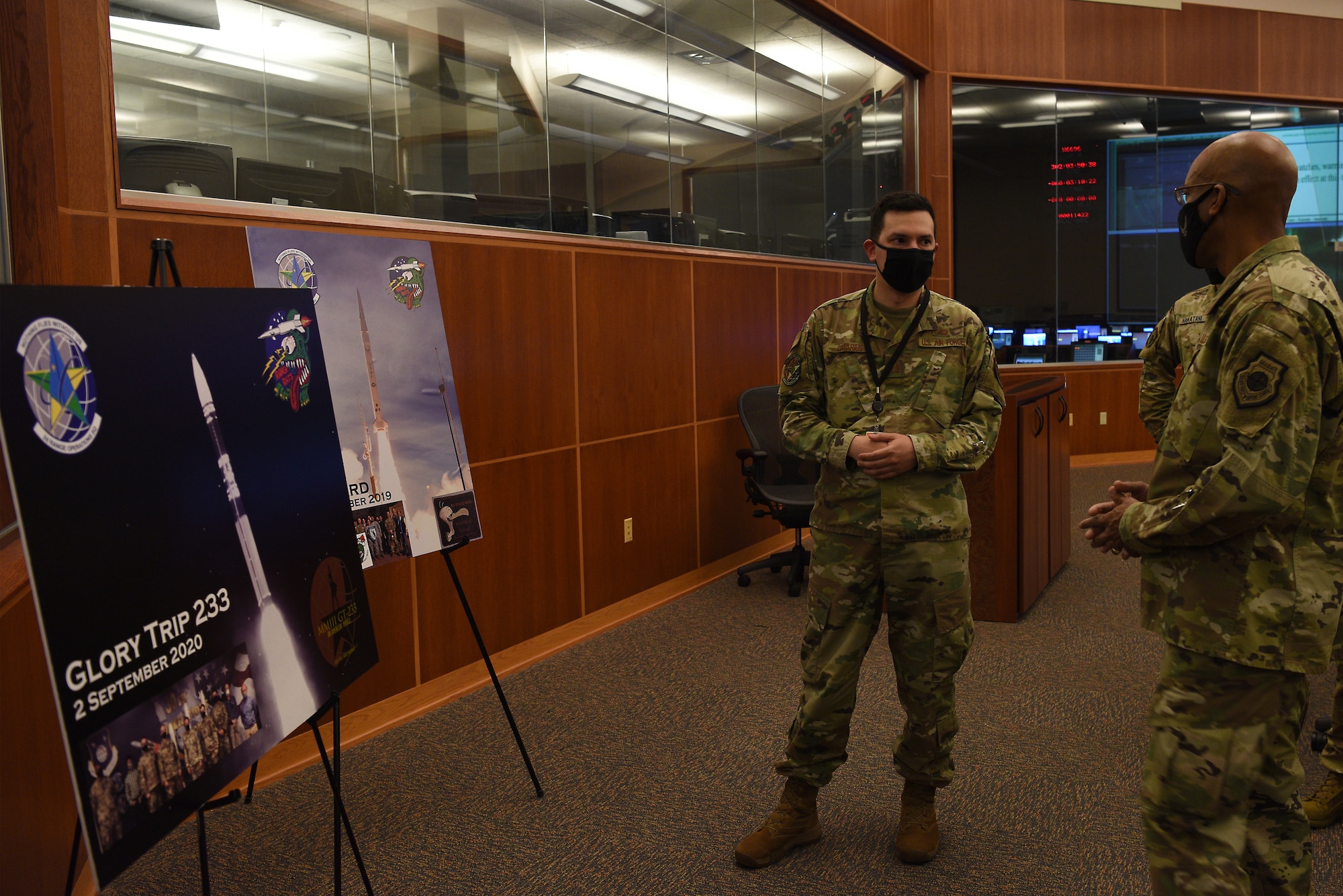 U.S Air Force Chief of Staff Gen. Charles Q. Brown, Jr., speaks with Capt. Adrian Catarius, 2nd Range Operations Squadron director of engineering, while touring the Western Range Operations Control Center Oct. 27, 2020, at Vandenberg Air Force Base, Calif.