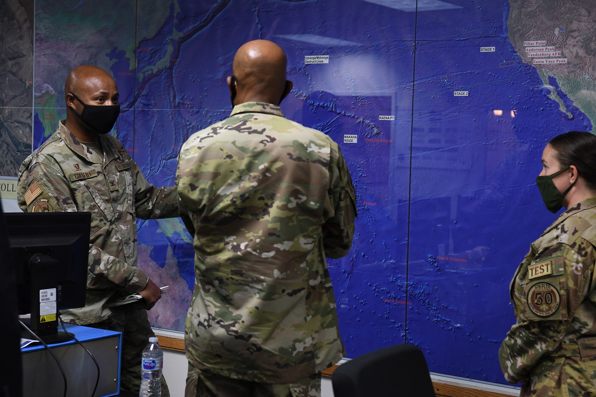 U.S Air Force Chief of Staff Gen. Charles Q. Brown, Jr., receives a briefing from Col. Omar Colbert, 576th Flight Test Squadron commander, and Capt. Morgan Pack, 576th FLTS intercontinental ballistic missile test operator, during a tour Oct. 27, 2020, at Vandenberg Air Force Base, Calif.