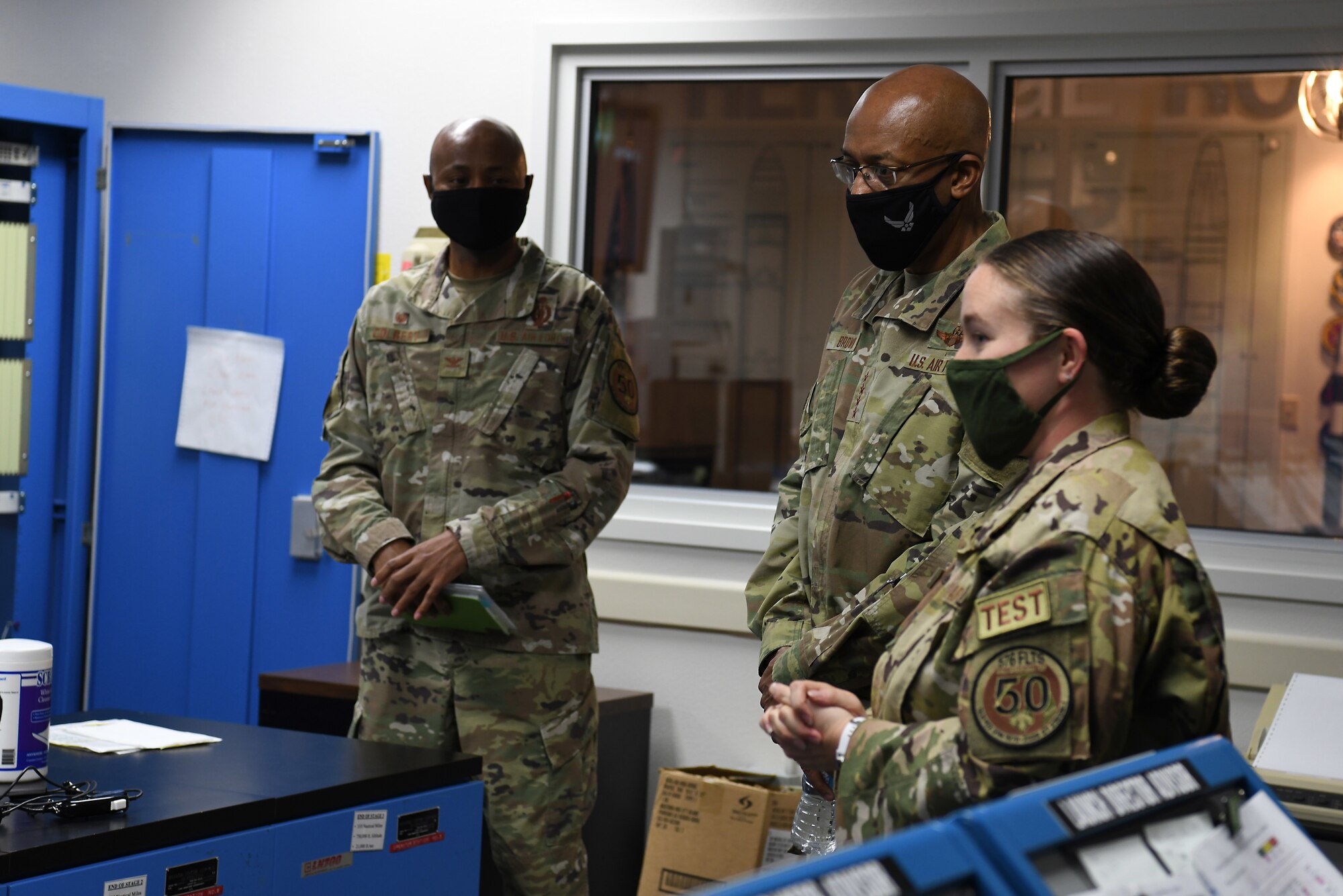 U.S Air Force Chief of Staff Gen. Charles Q. Brown, Jr., receives a briefing from Col. Omar Colbert, 576th Flight Test Squadron commander, and Capt. Morgan Pack, 576th FLTS intercontinental ballistic missile test operator, during a tour Oct. 27, 2020, at Vandenberg Air Force Base, Calif.