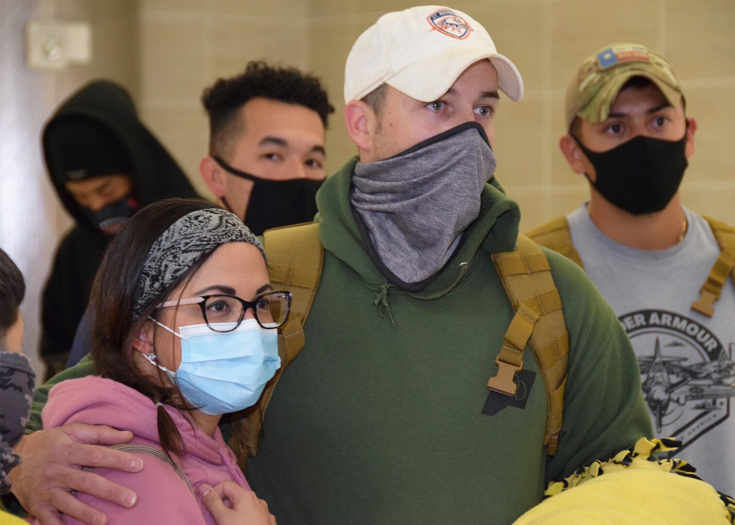 Tech. Sgt. Michael T. Strickler, 433rd Security Forces Squadron, is welcomed home at the San Antonio International Airport by his fiancée, Vanessa Narvaez, after having arrived from deployment Oct. 26, 2020. Strickler and 12 other returning deployers are given one last brief before being released to family members. (U.S. Air Force photo by Tech. Sgt. Iram Carmona)