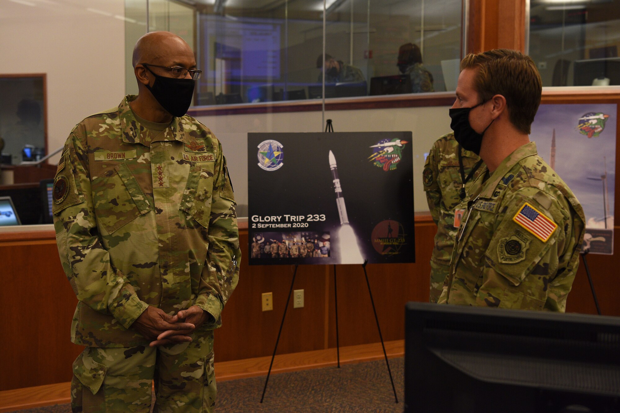U.S Air Force Chief of Staff Gen. Charles Q. Brown, Jr., speaks with Lt. Col. Sean Ianacone, 2nd Range Operations Squadron commander, while visiting the Western Range Operations Control Center Oct. 27, 2020, at Vandenberg Air Force Base, Calif.