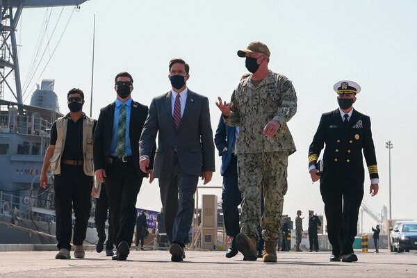 201028-N-KC128-1114 NAVAL SUPPORT ACTIVITY BAHRAIN (Oct. 28, 2020) Capt. Christopher Gilbertson, commander, Task Force (CTF) 55, second from right, speaks to Secretary of Defense Dr. Mark T. Esper during a visit on board Naval Support Activity Bahrain, Oct. 28. NAVCENT is the U.S. Navy element of U.S. Central Command in the U.S. 5th Fleet area of operations and encompasses about 2.5 million square miles of water area and includes the Arabian Gulf, Gulf of Oman, Red Sea and parts of the Indian Ocean. The expanse is comprised of 20 countries and includes three critical choke points at the Strait of Hormuz, the Suez Canal and the Strait of Bab al Mandeb at the southern tip of Yemen. (U.S. Navy photo by Mass Communication Specialist 1st Class Daniel Hinton)