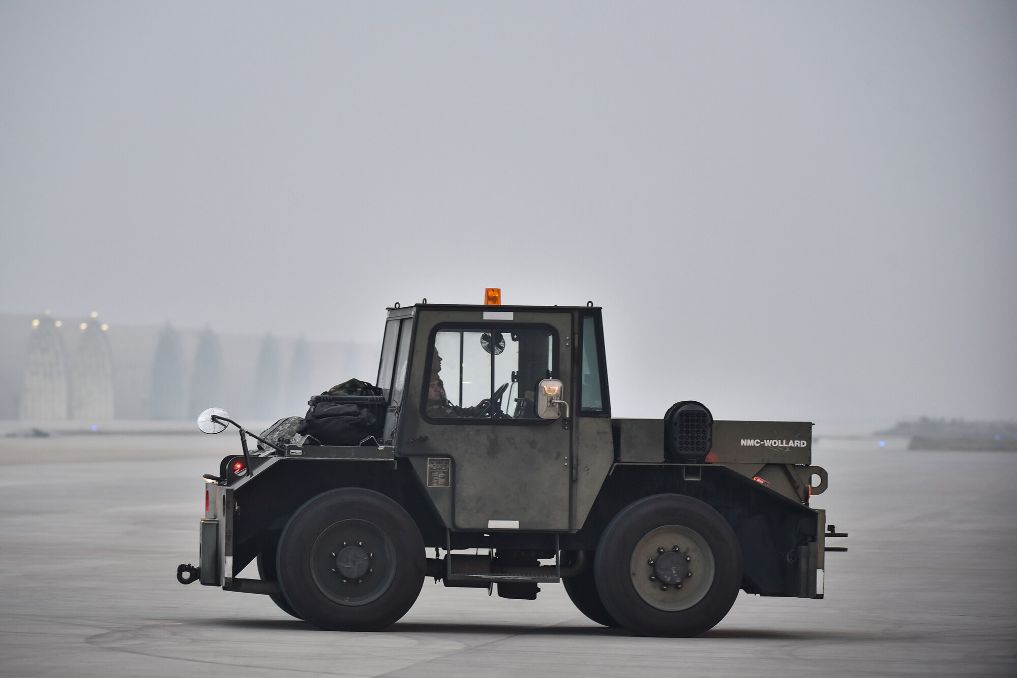 An Airman driving on the flightline.