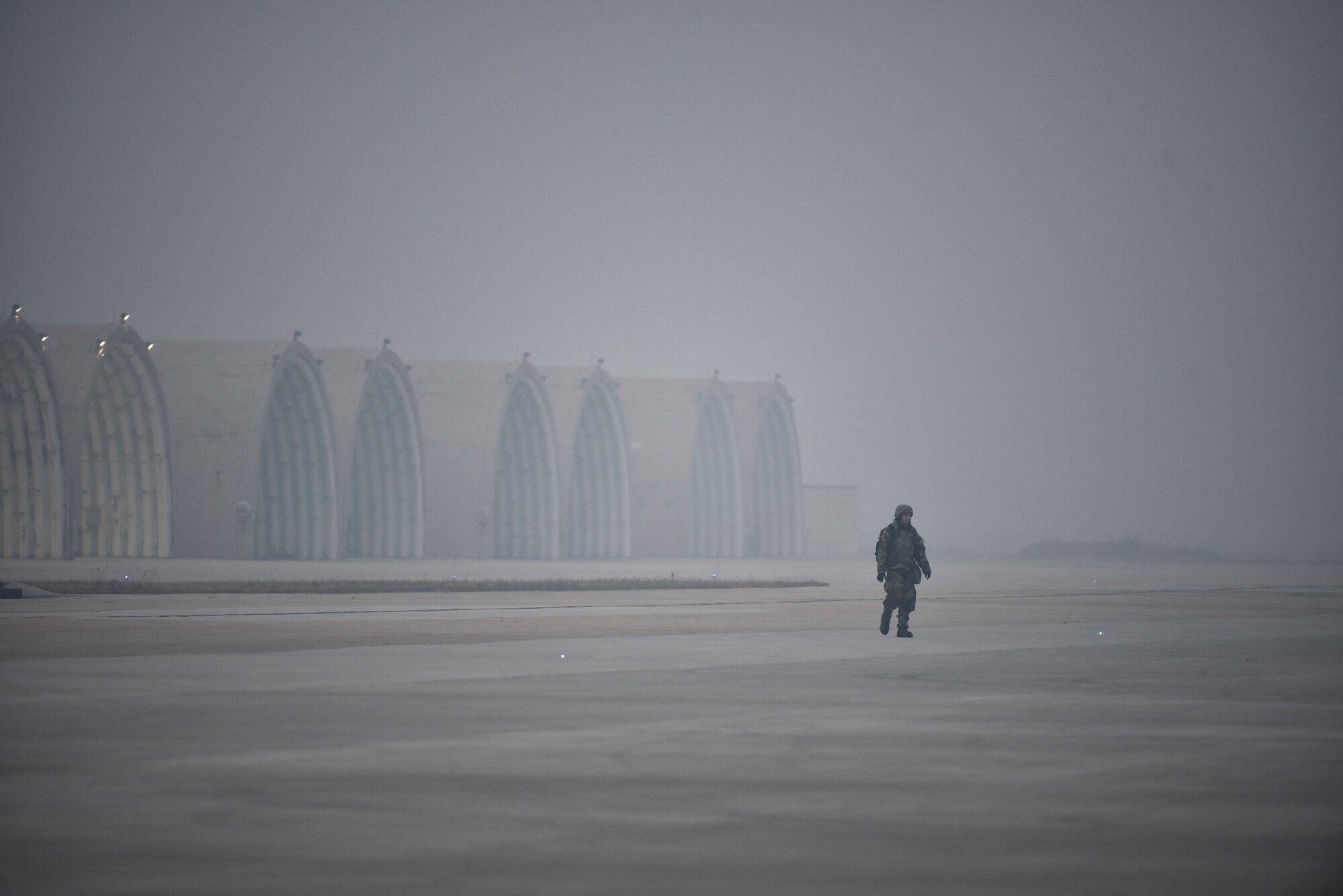 An Airman walking down the flightline.