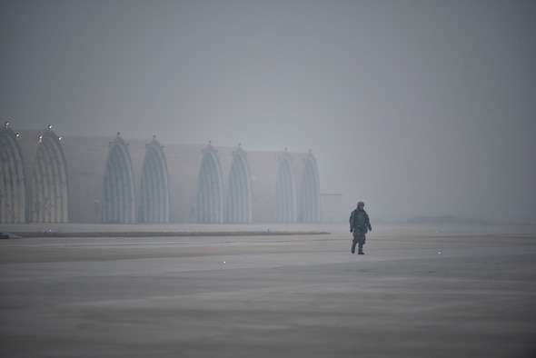 An Airman walking down the flightline.