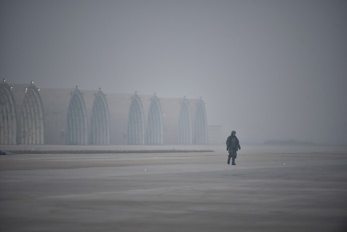 An Airman walking down the flightline.
