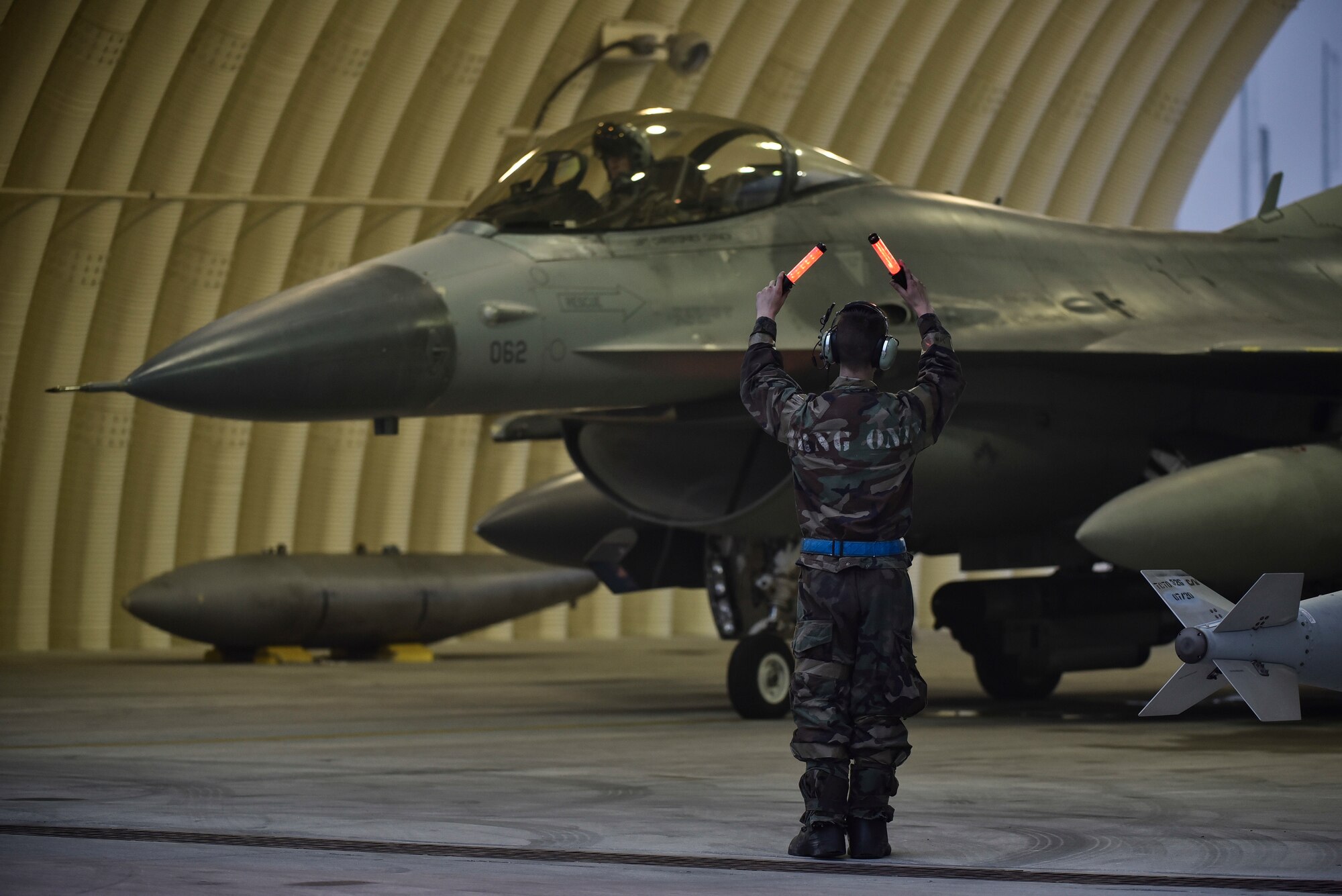 An Airman marshalling aircraft.