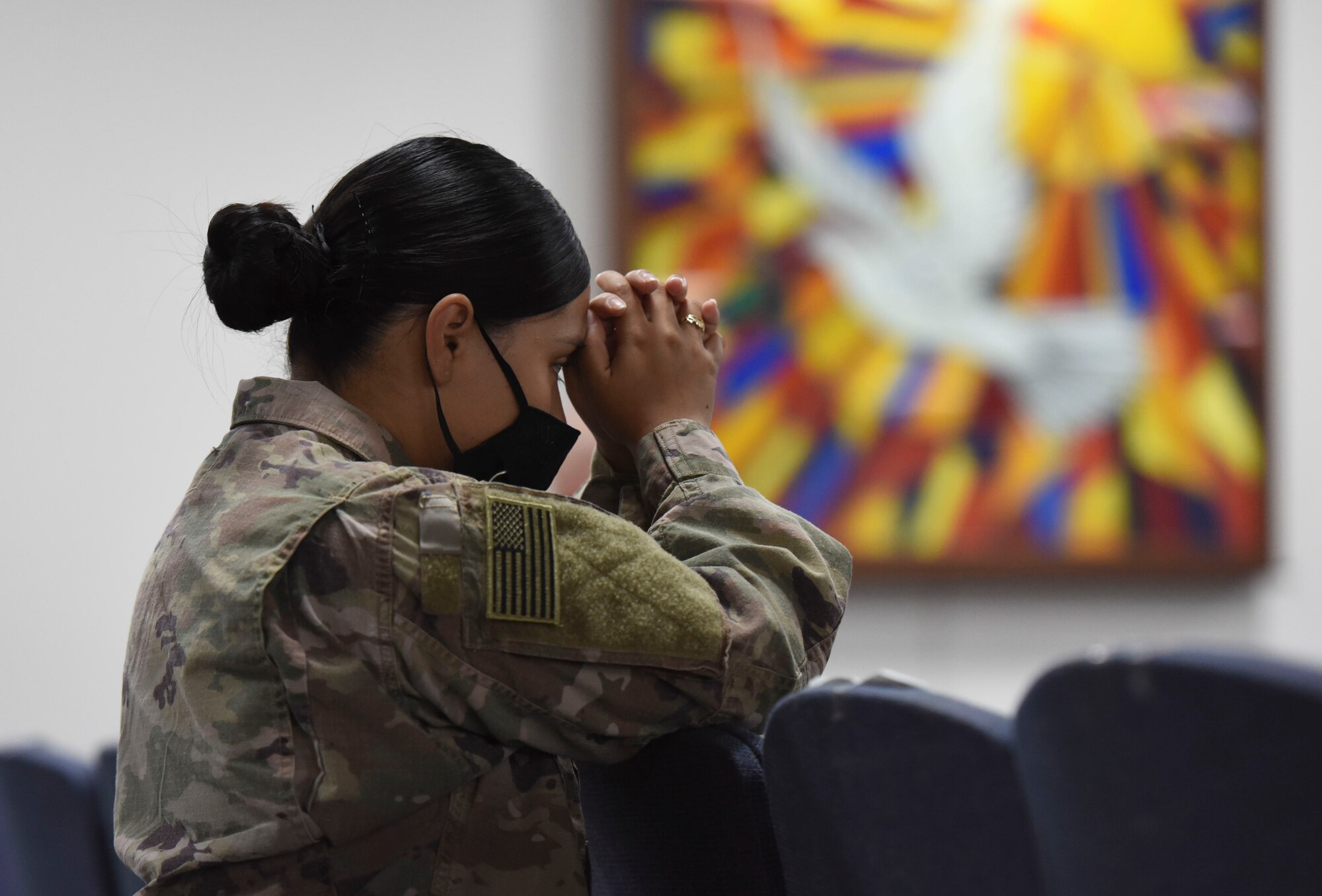 A U.S. Air Force Airman prays during a Catholic service at Ali Al Salem Air Base, Kuwait, Sept. 13, 2020.