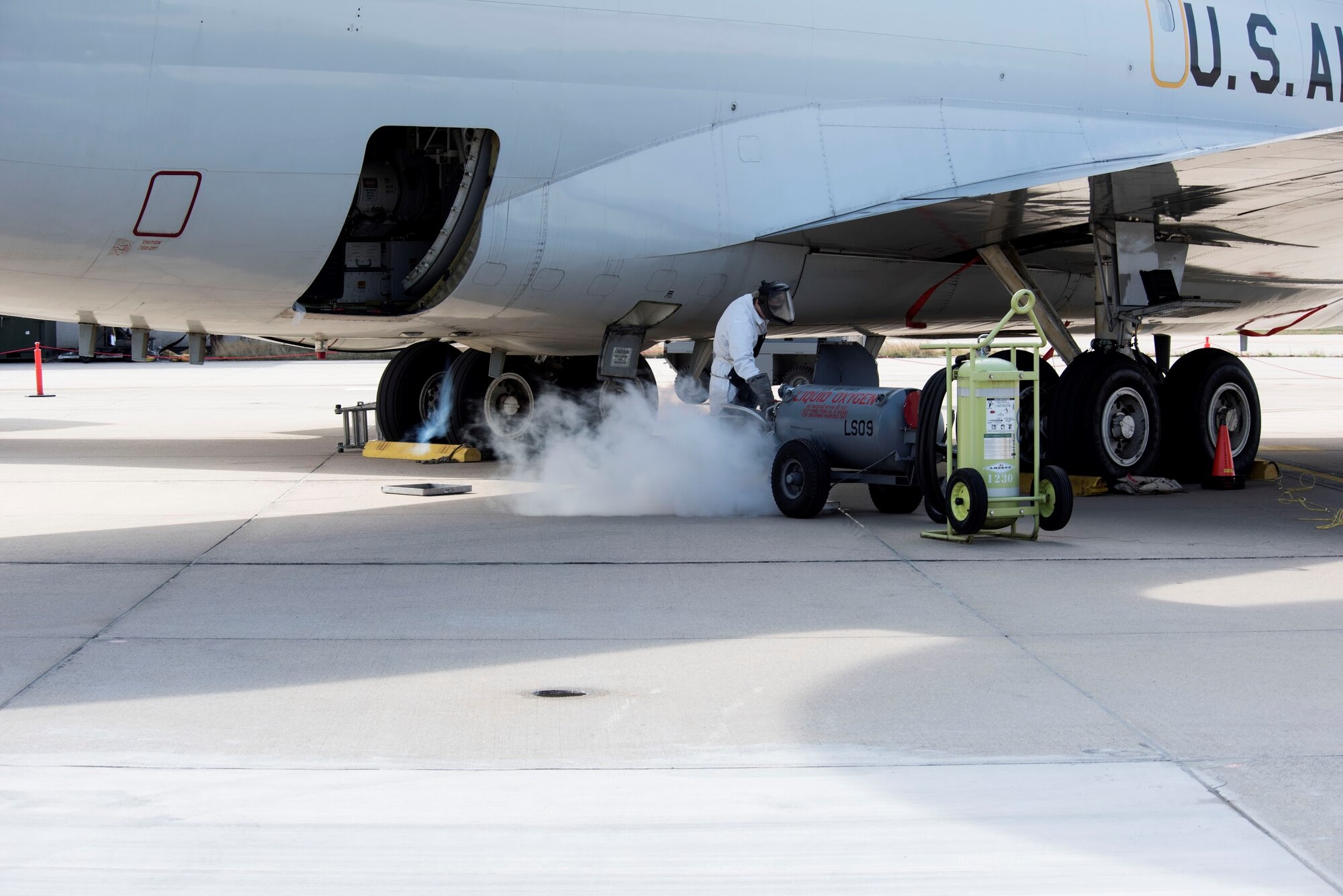 Photo working on an airplane on the flightline