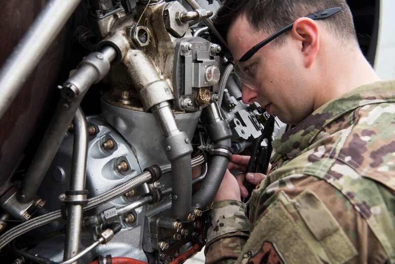 Photo of Airman working on an airplane.