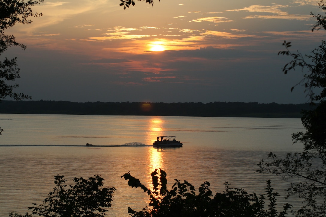 A boat pulls a tuber on a U.S Army Corps of Engineers lake.