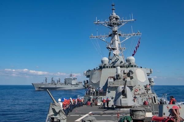 USS Barry (DDG 52) breaks away following an underway replenishment with the  Japan Maritime Self Defense Force (JMSDF) Mashu-class replenishment ship JS Mashu (AOE 425) during exercise Keen Sword 21.
