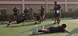Soldiers from the 311th Expeditionary Sustainment Command, 3rd Medical Command, 401st Army Field Support Brigade, and the 304th Sustainment Brigade perform joint training on the Hand Release Push-up in preparation for executing and grading the Army Combat Fitness Test at the Area Support Group-Kuwait Field Oct. 6, 2020. This training was conducted as part of the 1st Theater Sustainment Command’s ACFT familiarization and grader validation and is ensuring readiness for the Army units currently serving at Camp Arifjan, Kuwait. (U.S. Army Photo by Spc. Andrew E. Figueroa)