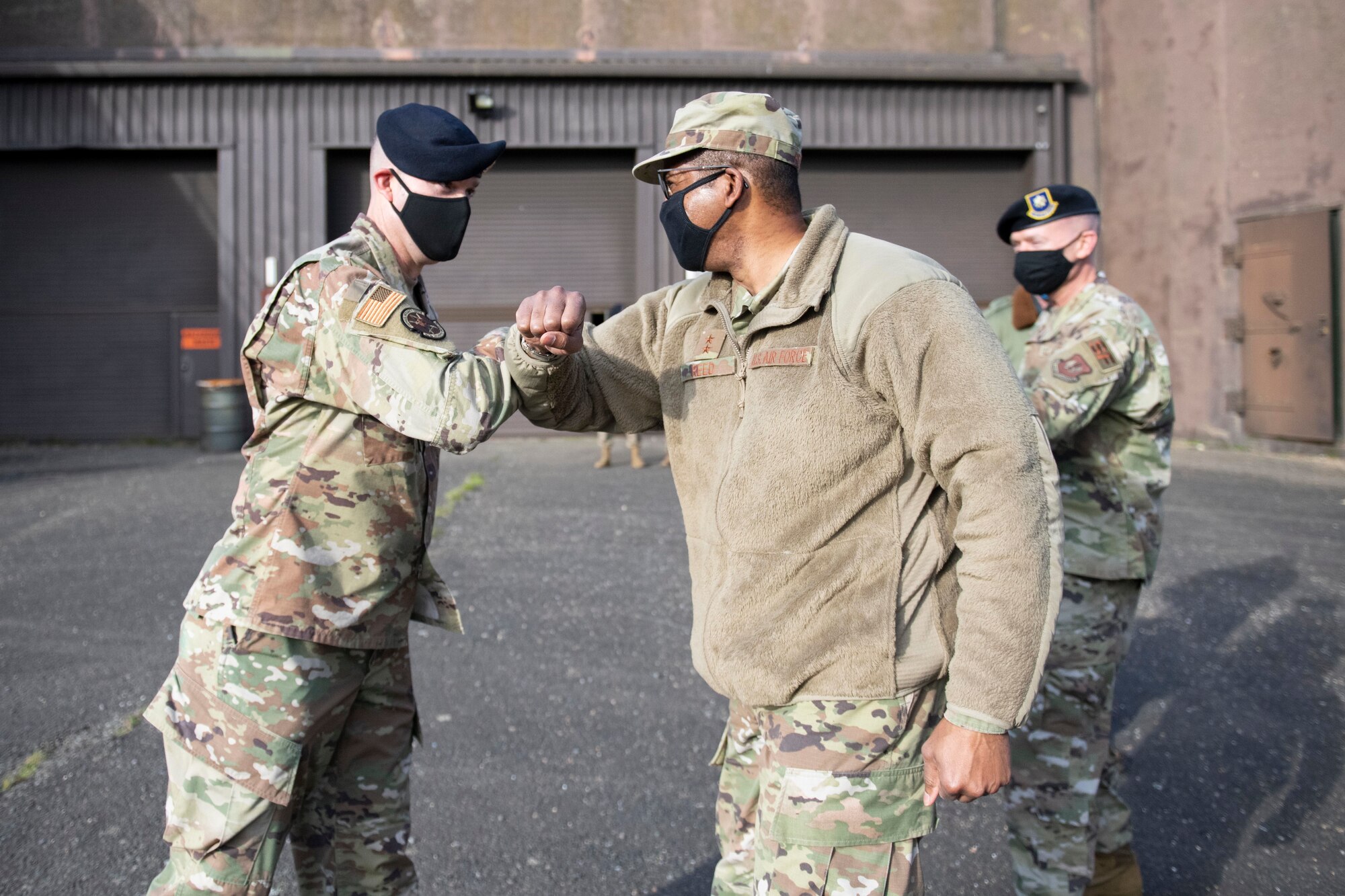 U.S. Air Force Senior Master Sgt. Jeremy Burkeen (left), 423rd Security Forces Squadron superintendent of operations, greets Maj. Gen. Randall Reed (right), Third Air Force commander, during his visit to the training shoot house bunker at Royal Air Force Molesworth, England, Oct. 26, 2020. The Third Air Force command team toured six bases in the 501st Combat Support Wing as part of a new commander’s immersion tour. (U.S. Air Force photo by Senior Airman Jennifer Zima)