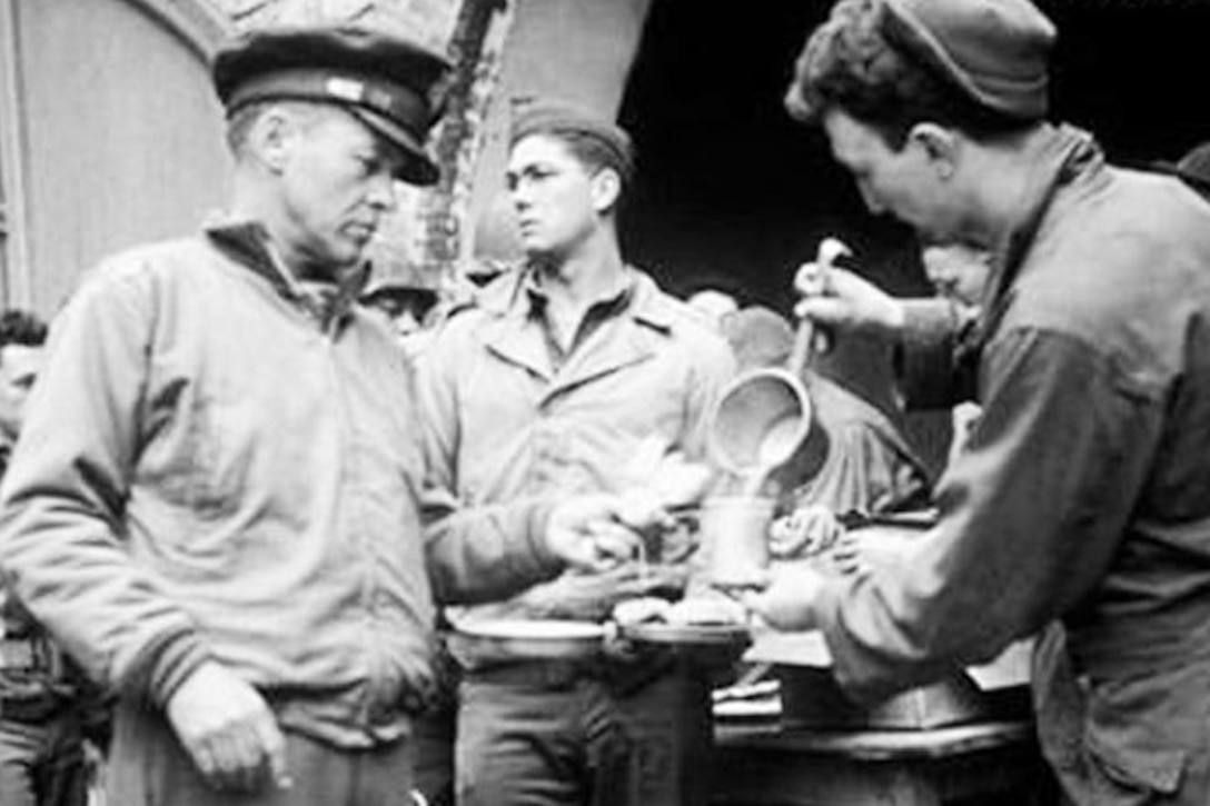 A soldier gets food.