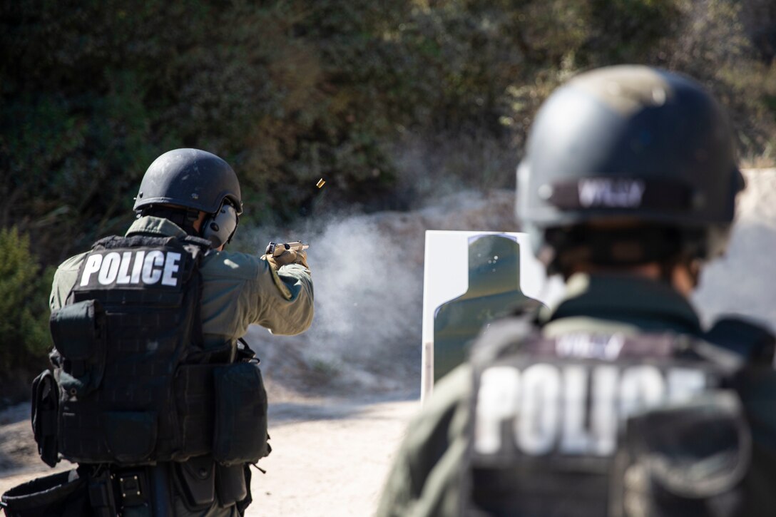 U.S. Marines engage targets with M45A1 close-quarters battle pistols during live-fire training at Range 206 on Camp Pendleton, Calif., Oct. 21.