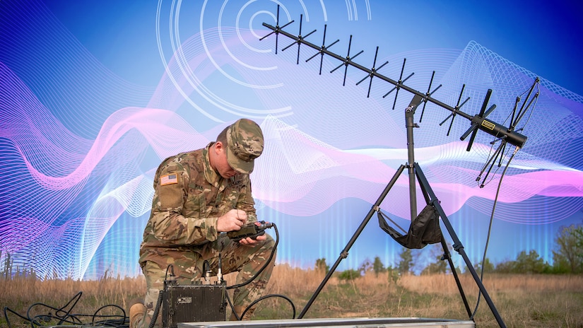 An illustration depicting a soldier kneeling in the grass and operating electronic equipment.