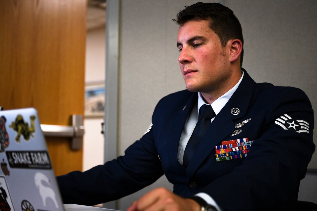 A photo of an Airman preparing for a ceremony
