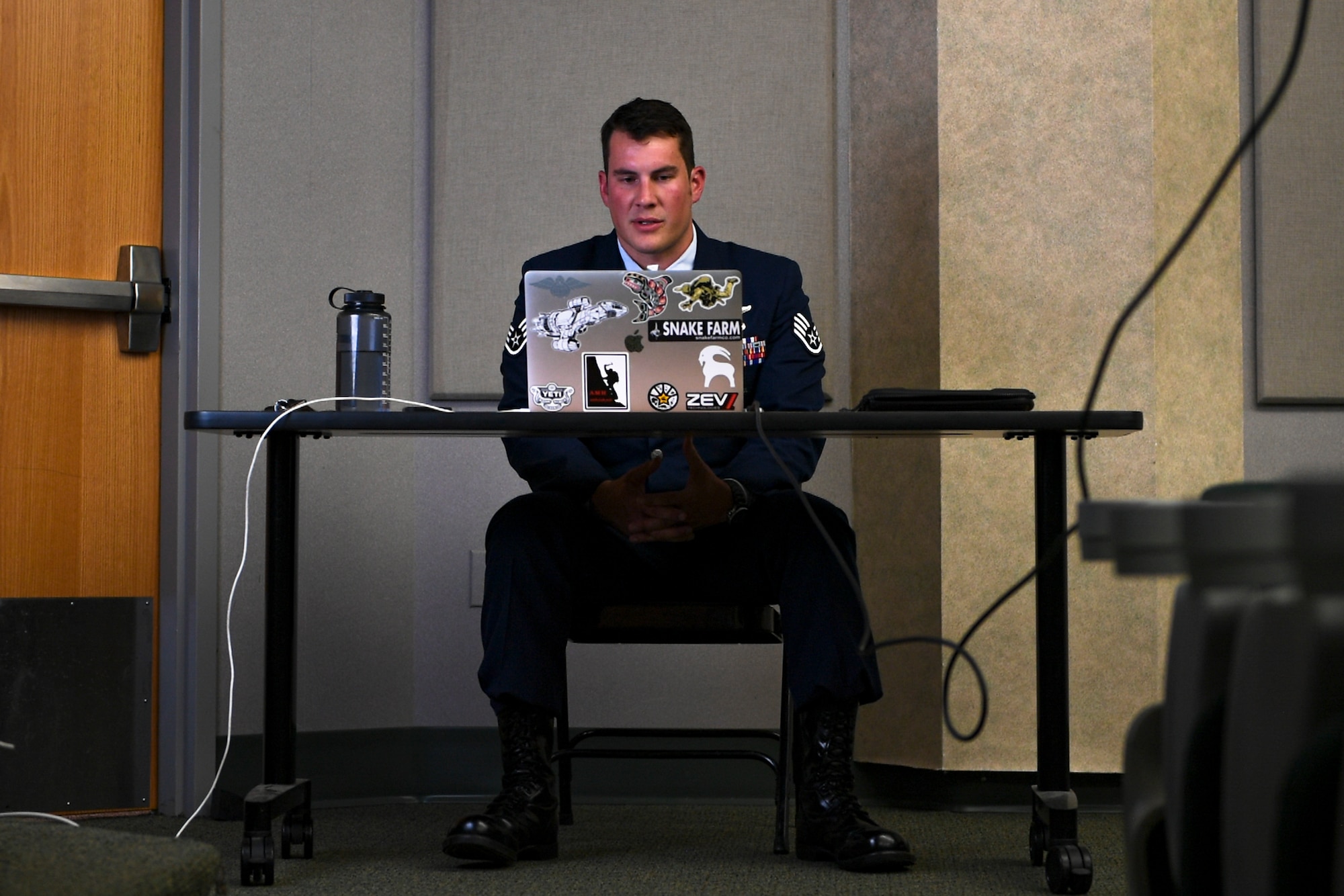A photo of an Airman speaking during a ceremony