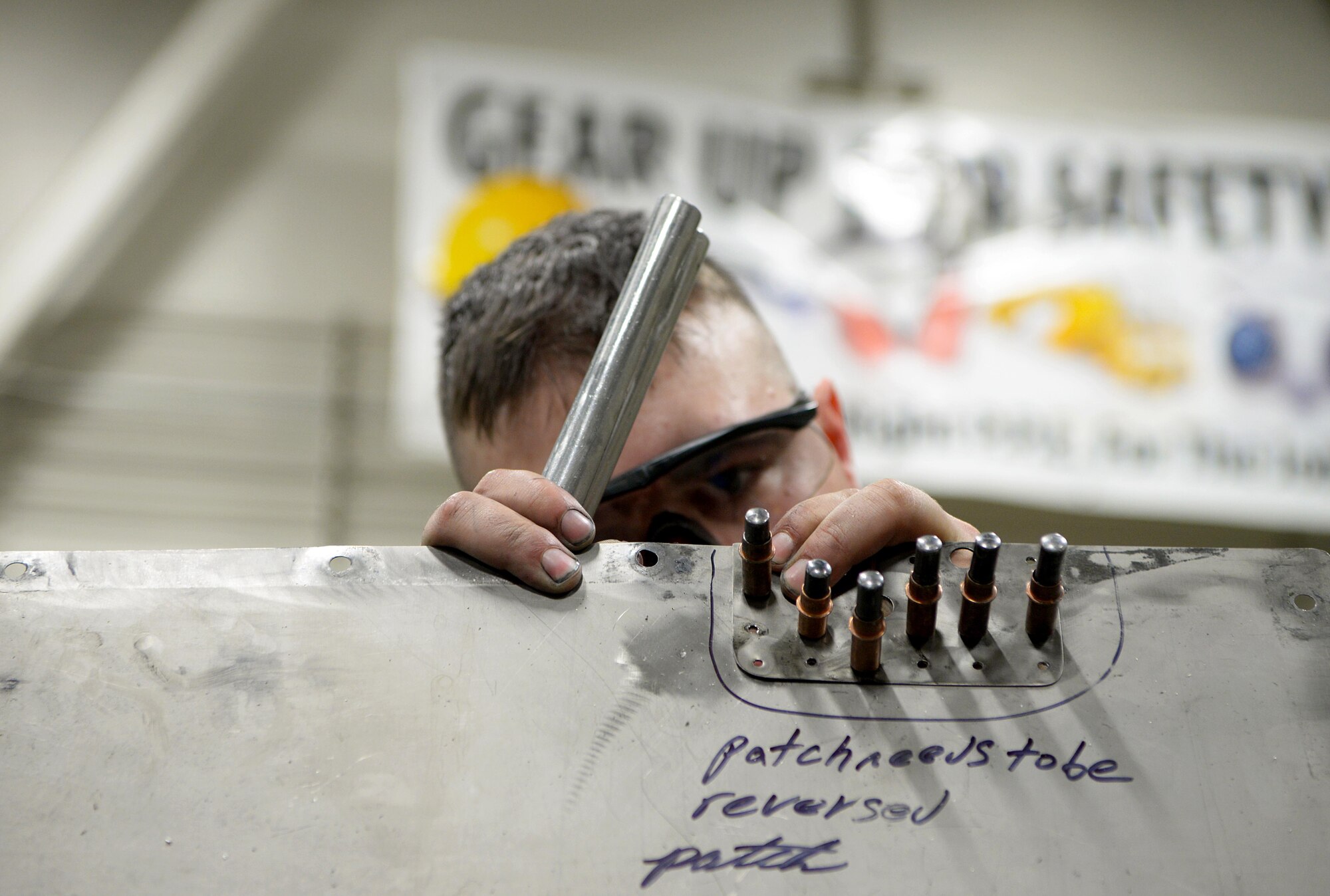 U.S. Air Force Airman 1st Class William Whitworth, a 354th Maintenance Squadron Aircraft Structural Maintenance journeyman, works on an F-16 Fighting Falcon panel on Eielson Air Force Base, Alaska, Oct. 8, 2020.