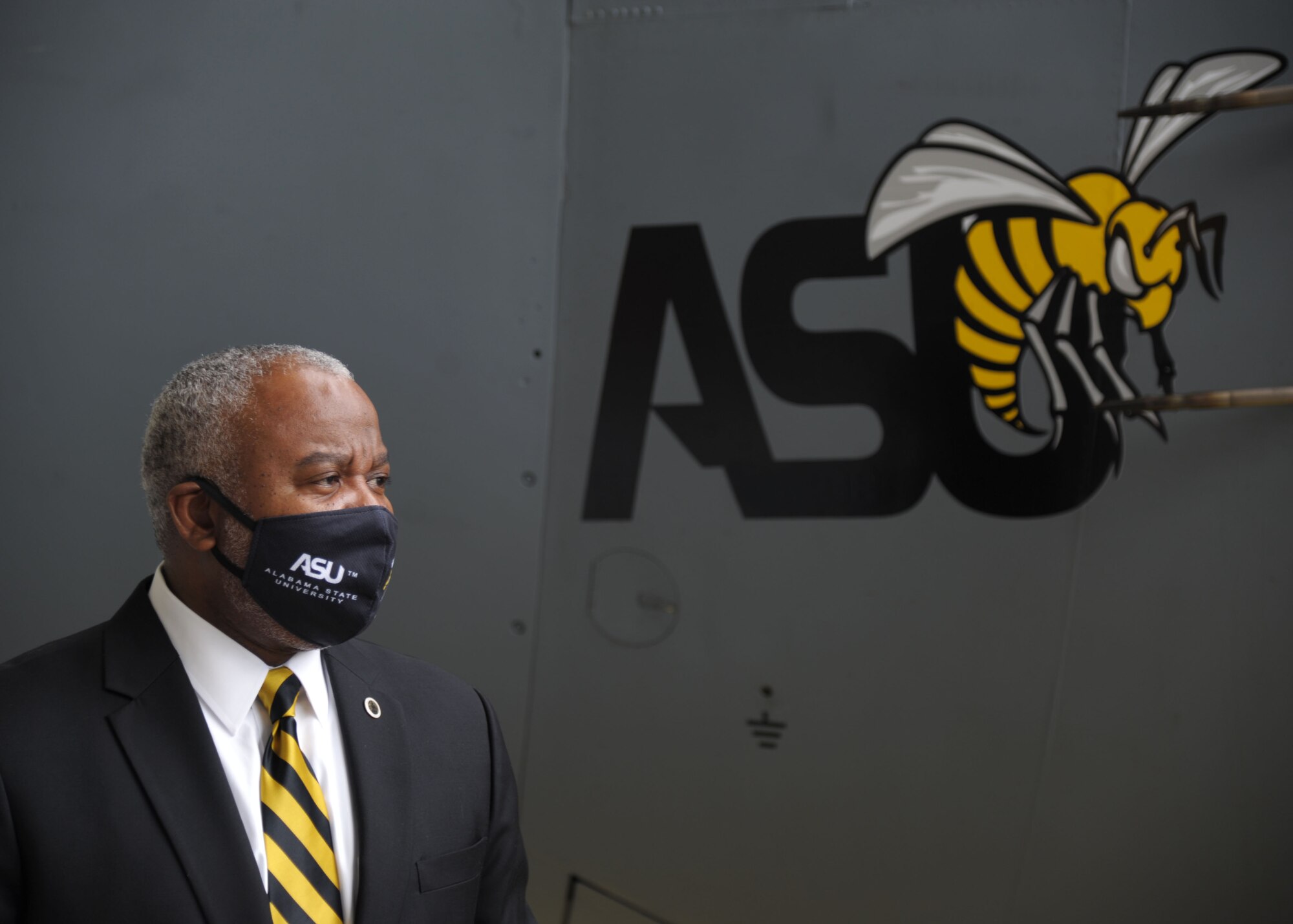 Dr. Quinton T. Ross Jr., president of Alabama State University, stands by the newly unveiled ASU nose art at Maxwell Air Force Base, Alabama. The 908th Airlift Wing commemorated its partnership with ASU by painting the university’s logo on the nose of one of its C-130 H aircraft. (U.S. Air Force photo by Senior Airman Max Goldberg)