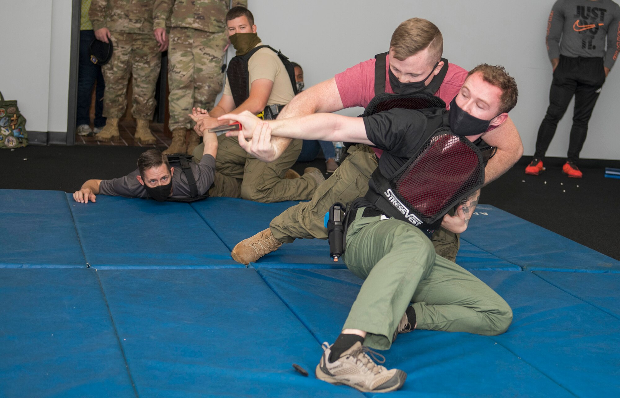 Staff Sgt. Kody Negri, 802d Security Forces Squadron, Staff Sgt. William McLaughlin, 502d SFS, Sgt. Michael Aulner, 502d SFS and Officer Jeremy Quinn, 802d SFS participate in combative training at the Alamo Area Council of Governments, San Antonio, Texas, Oct 22, 2020.