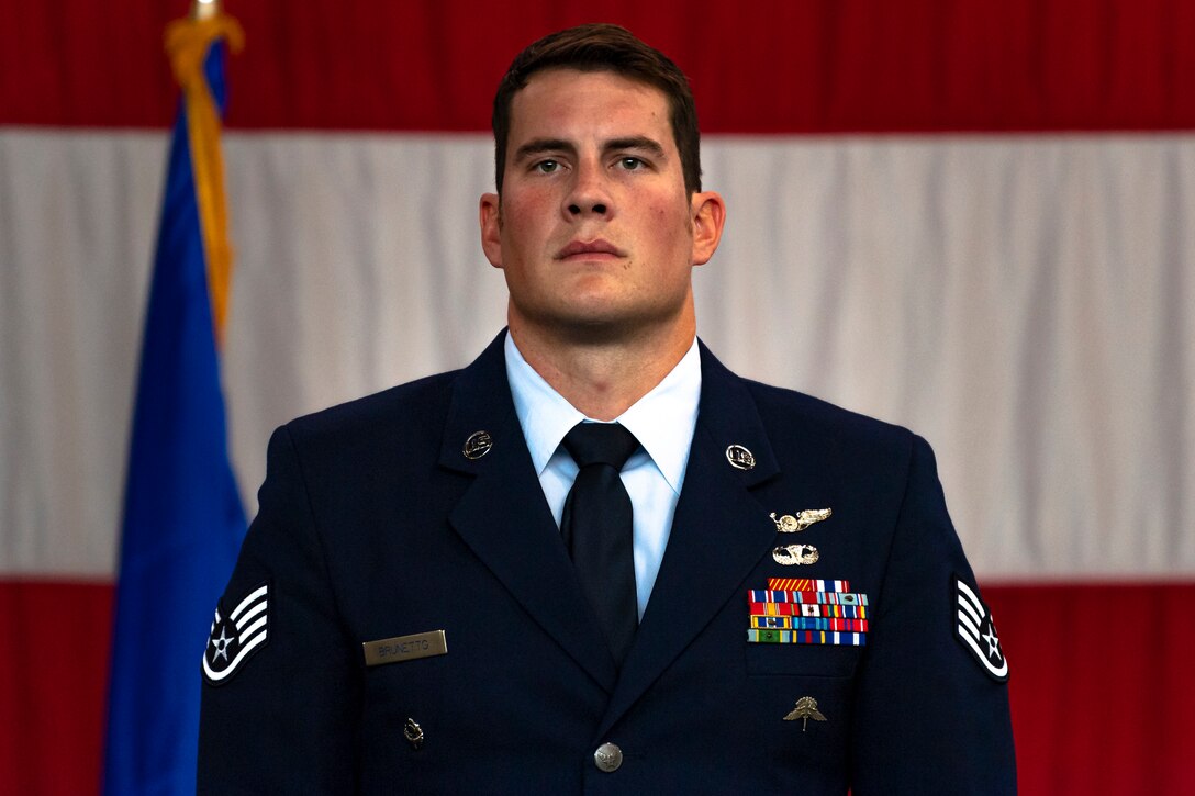 A photo of an Airman standing at attention during a ceremony