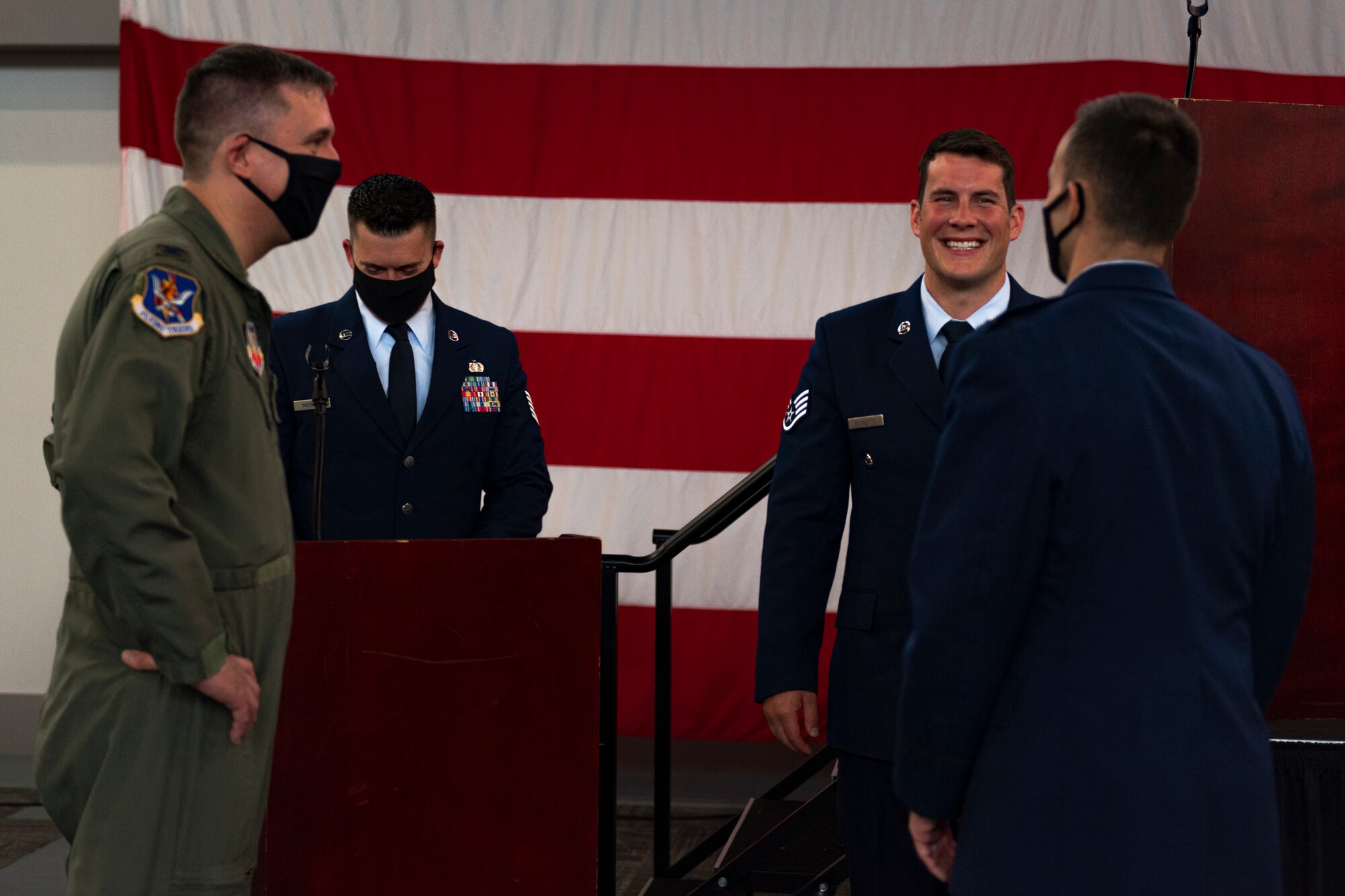 A photo of Airmen talking after a ceremony