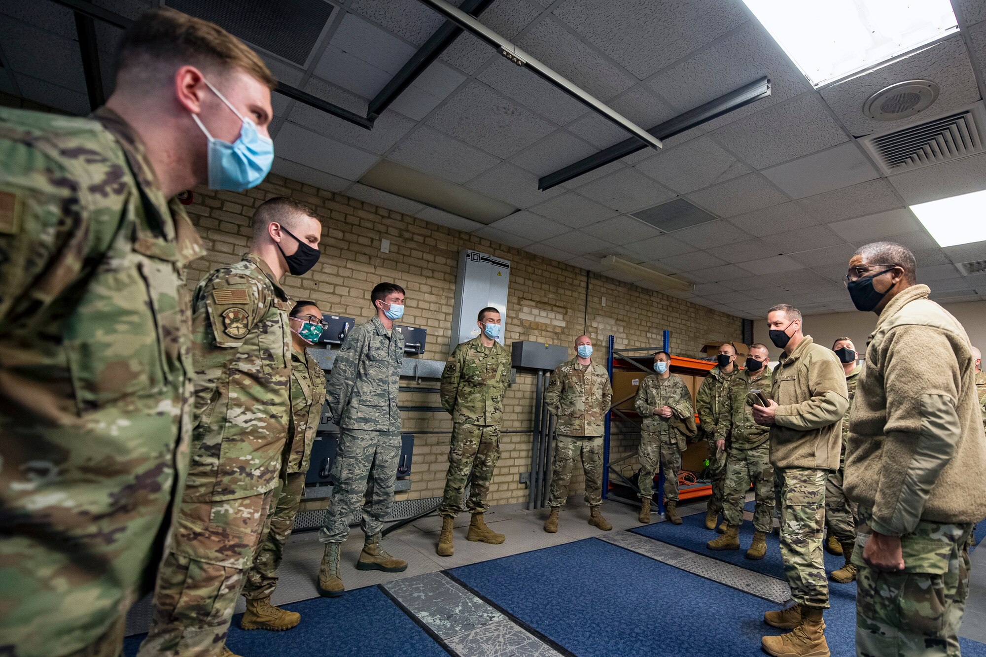 U.S. Air Force Maj. Gen. Randall Reed (right), Third Air Force commander and Chief Master Sgt. Randy Kwiatkowski (center right), Third Air Force command chief, speaks with Airmen from the 422nd Communications Squadron at Royal Air Force Barford St. John, England, Oct. 27, 2020. The Third Air Force command team visited RAF Barford St. John to speak and recognize 422nd CS Airmen, as well as visit the base's monuments to pay homage to the installation’s rich history. (U.S. Air Force photo by Senior Airman Eugene Oliver)
