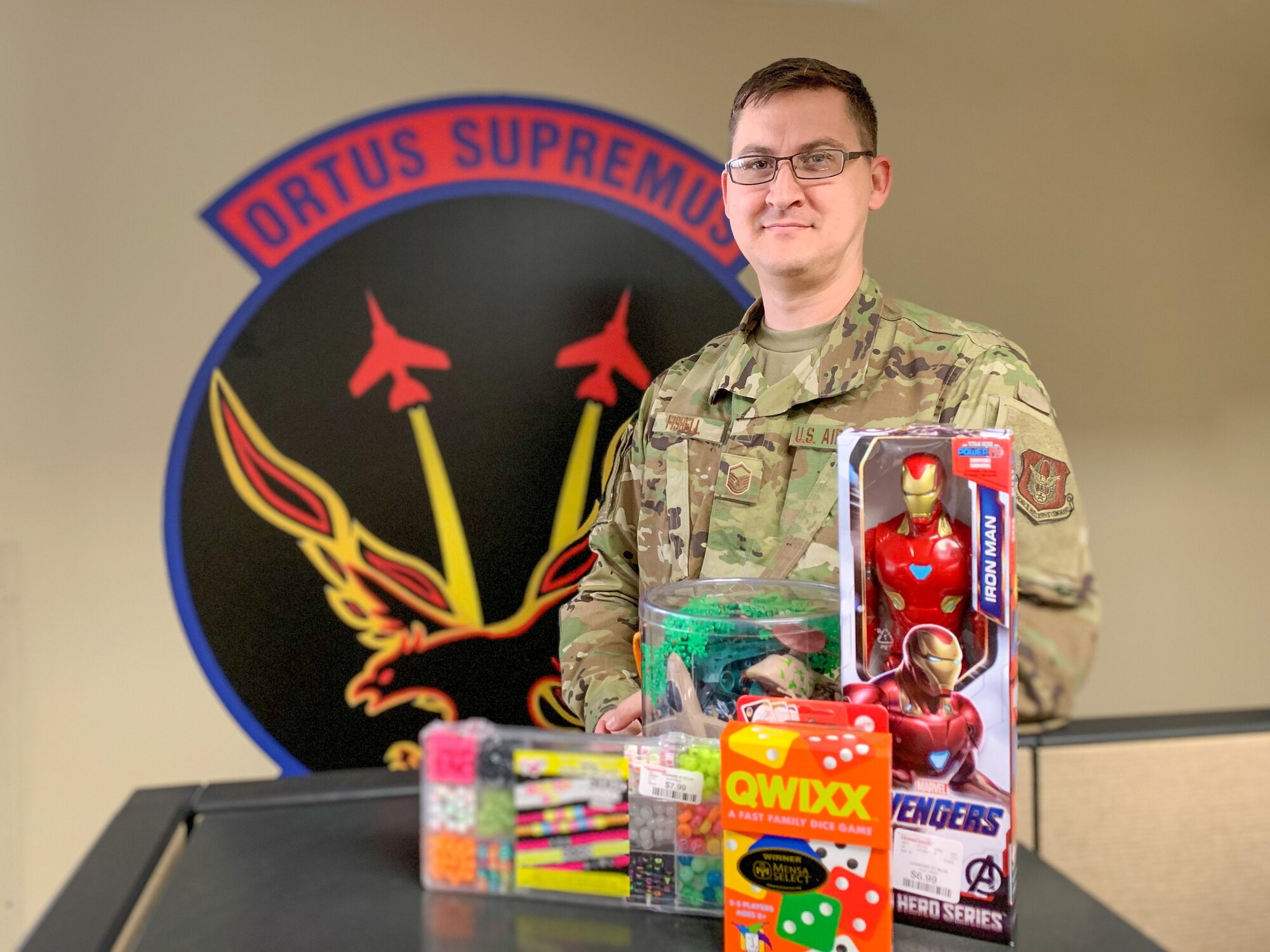 Master Sgt. Caleb Fishell, 926th Aircraft Maintenance Squadron’s unit training manager, poses with toys he plans to donate to a local nonprofit, Oct. 29, at Nellis Air Force Base, Nev. Fishell has been giving back to local Las Vegas families since 2012.