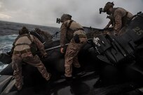 U.S. Marines assigned to Task Force Ellis, I Marine Expeditionary Force, prepare to launch a combat rubber raiding craft from a  Mk VI patrol boat assigned to Commander, Task Force 75 (CTF 75), during maritime operations.