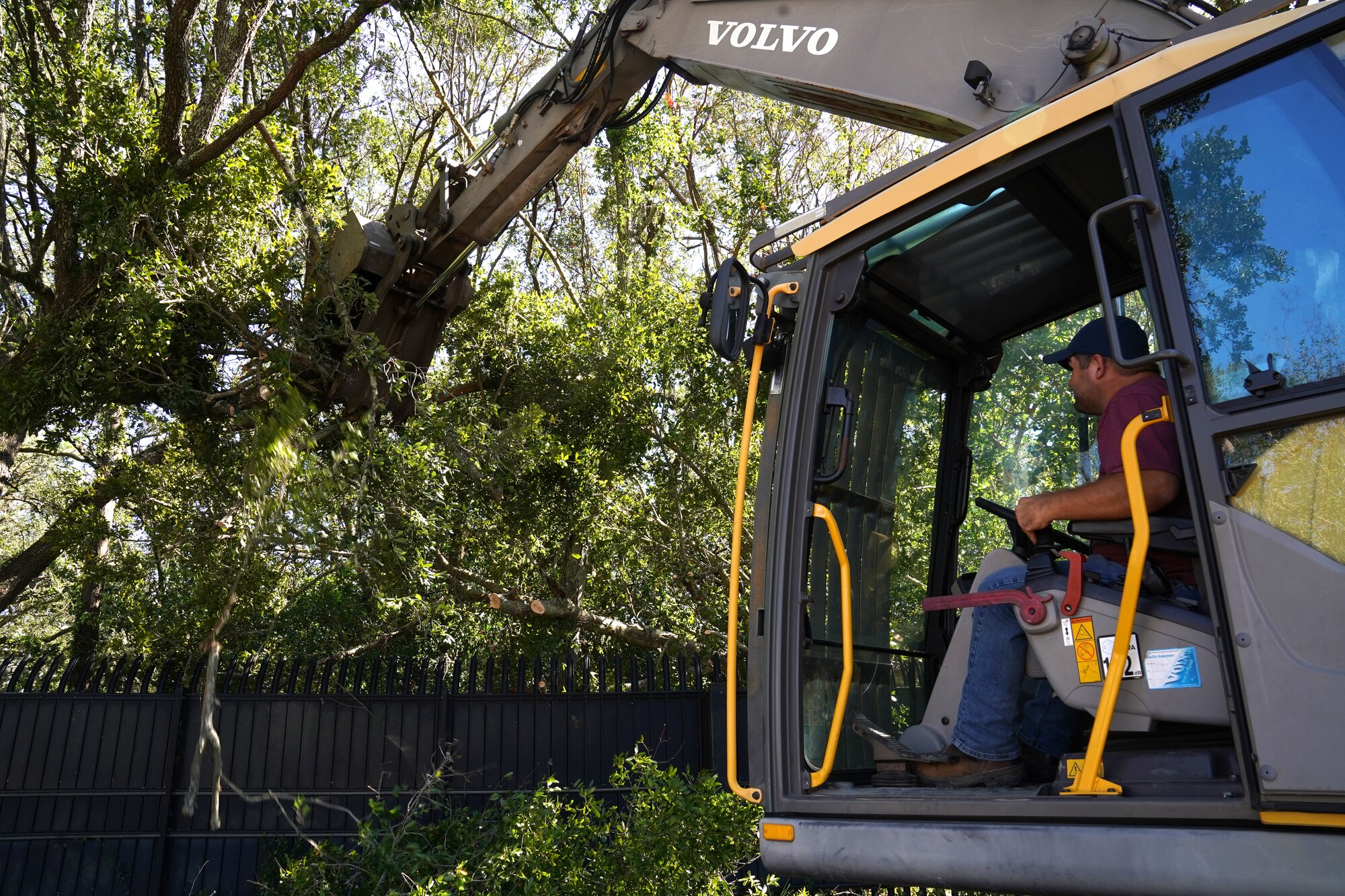 Adam Sullivan, Vectrus heavy equipment operator, operates an excavator at Keesler Air Force Base, Mississippi, Oct. 29, 2020. Members of the 81st Civil Engineering Squadron and Vectrus worked before, during and after Hurricane Zeta to ensure the base infrastructure was able to sustain the wind and rain during the storm. (U.S. Air Force photo by Airman 1st Class Seth Haddix)